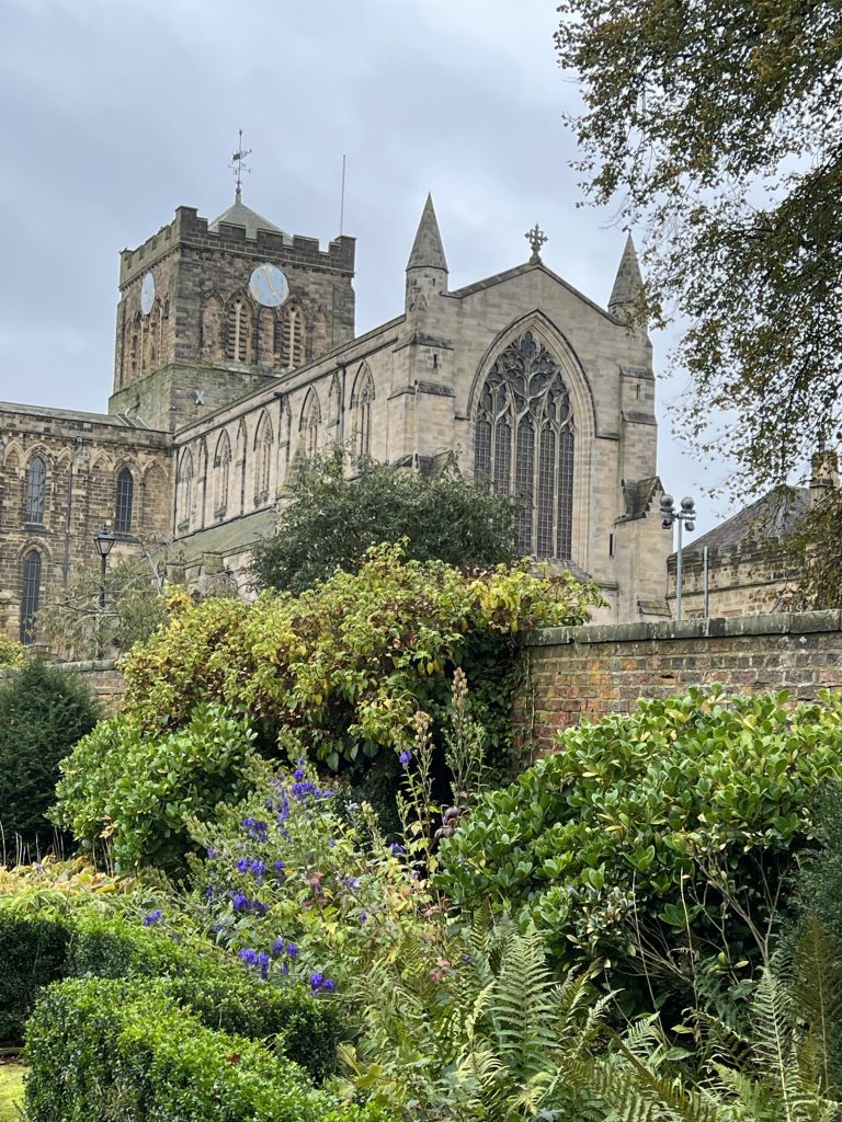 View of Hexham Abbey with gardens in front