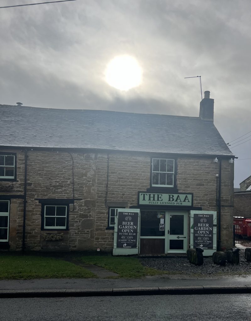 Unique country pub with sun behind